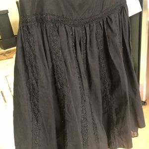 Black knee length skirt.